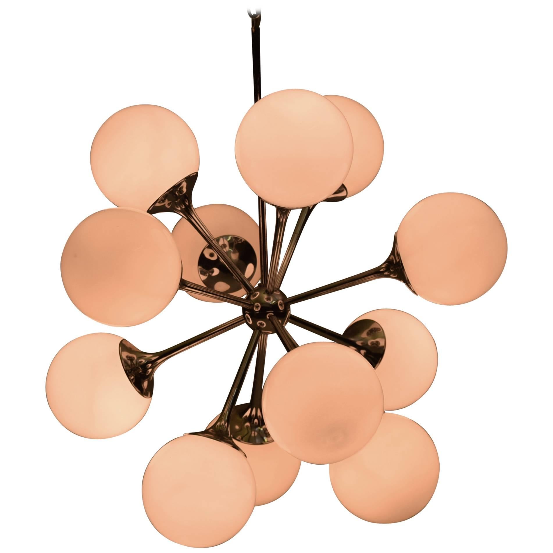 Featuring 12 globes each with 40 watt capacity, this pristine Lightolier chandelier features all original hardware inclusive of ceiling plate signed by the manufacturer.

Measures 22" diameter and with the chain total height is 32" (can