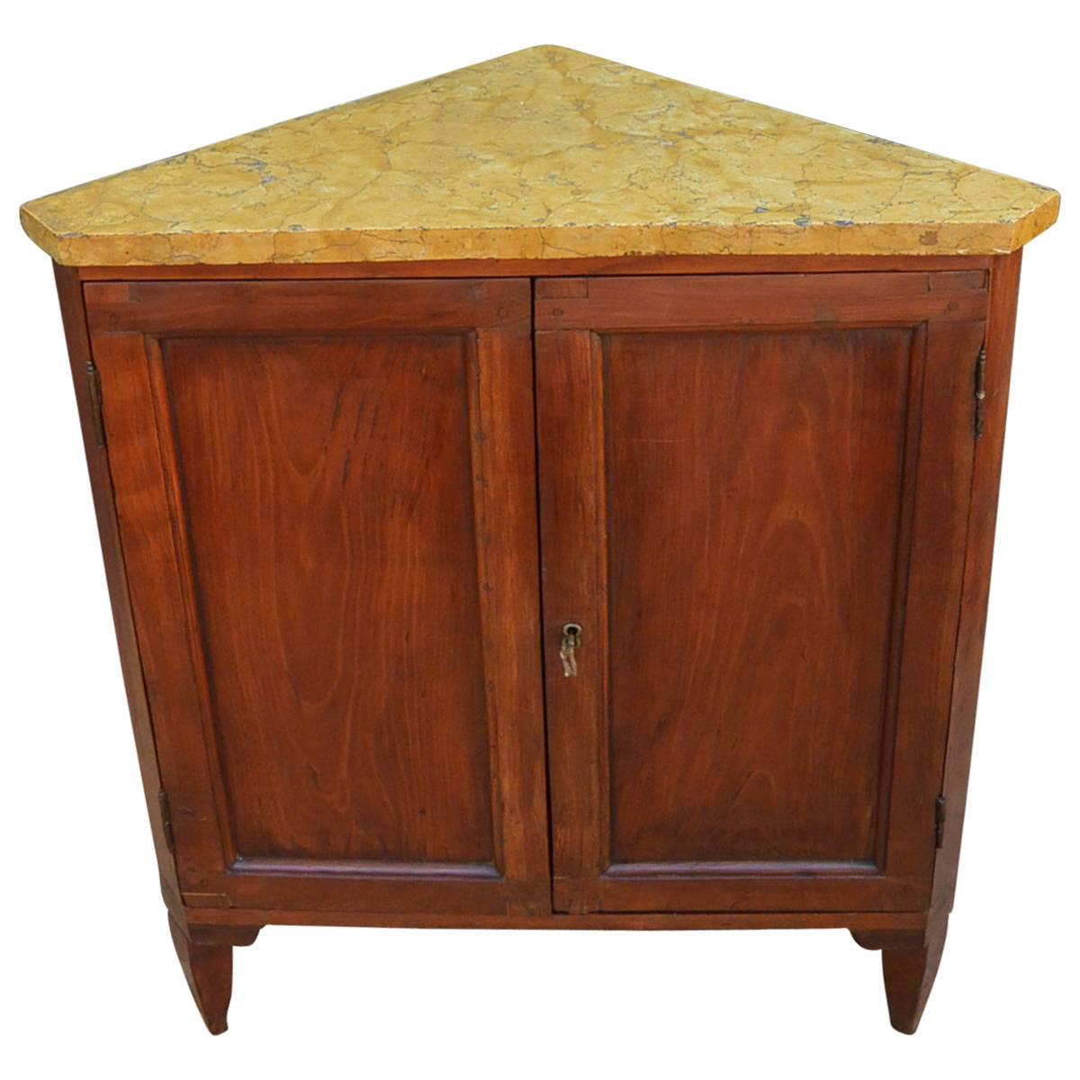 Provincial Louis XVI period cherrywood encoignure / angoliere /corner cabinet with Siena gold marble top; with interior shelf and key, Italy, late 18th century.
Dimension: 33.5