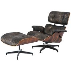 Rosewood Eames Lounge Chair and Ottoman Reupholstered in Acid Washed Cowhide