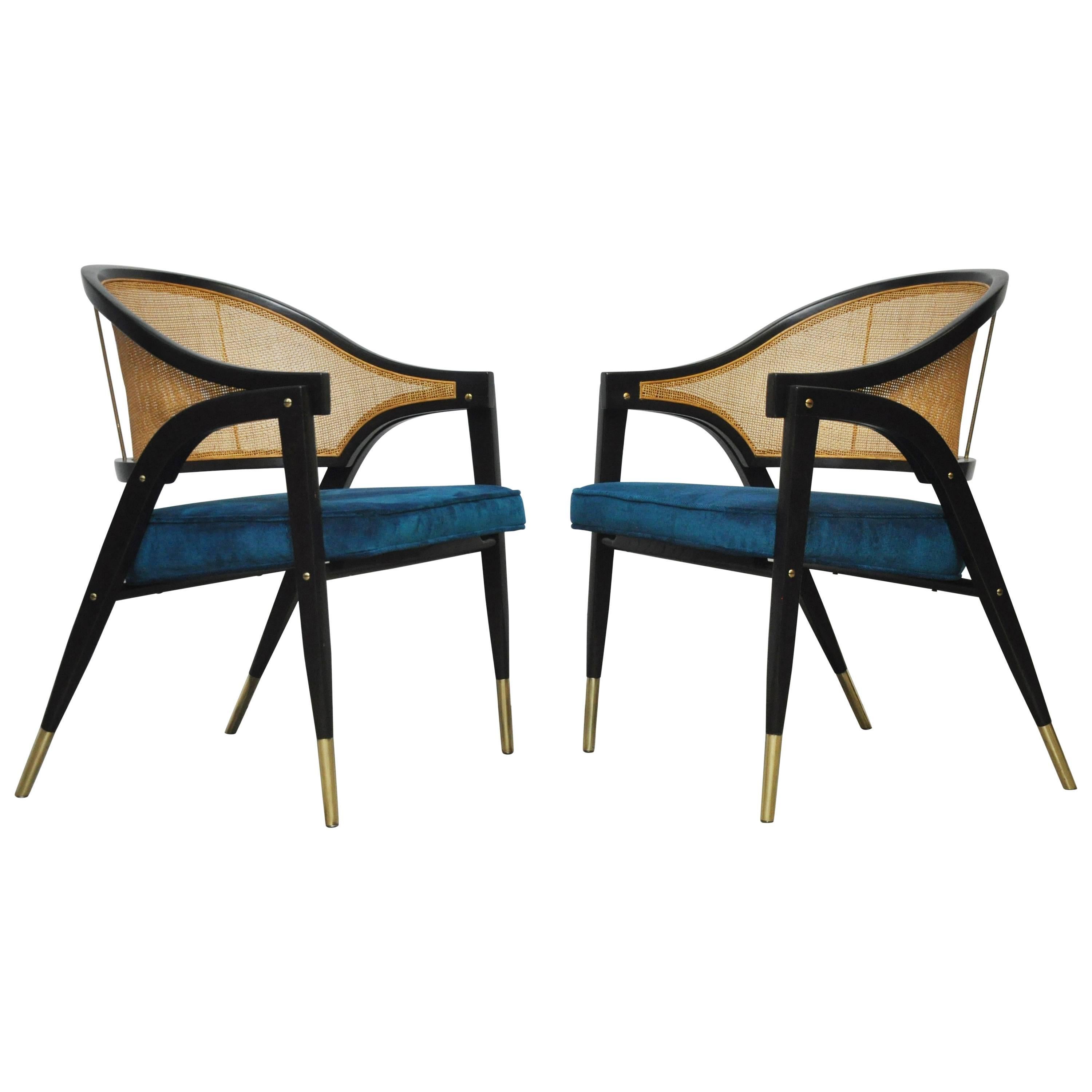 Pair of armchairs designed by Edward Wormley for Dunbar. Sculptural form dark finish frames with brass details. Cane backs, new blue velvet upholstered seats.