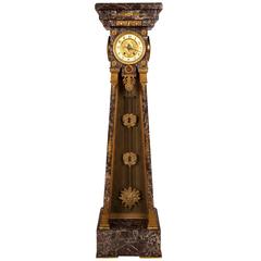 Empire Style Clock in a Marble Tapering Pedestal with a Sunburst Pendulum