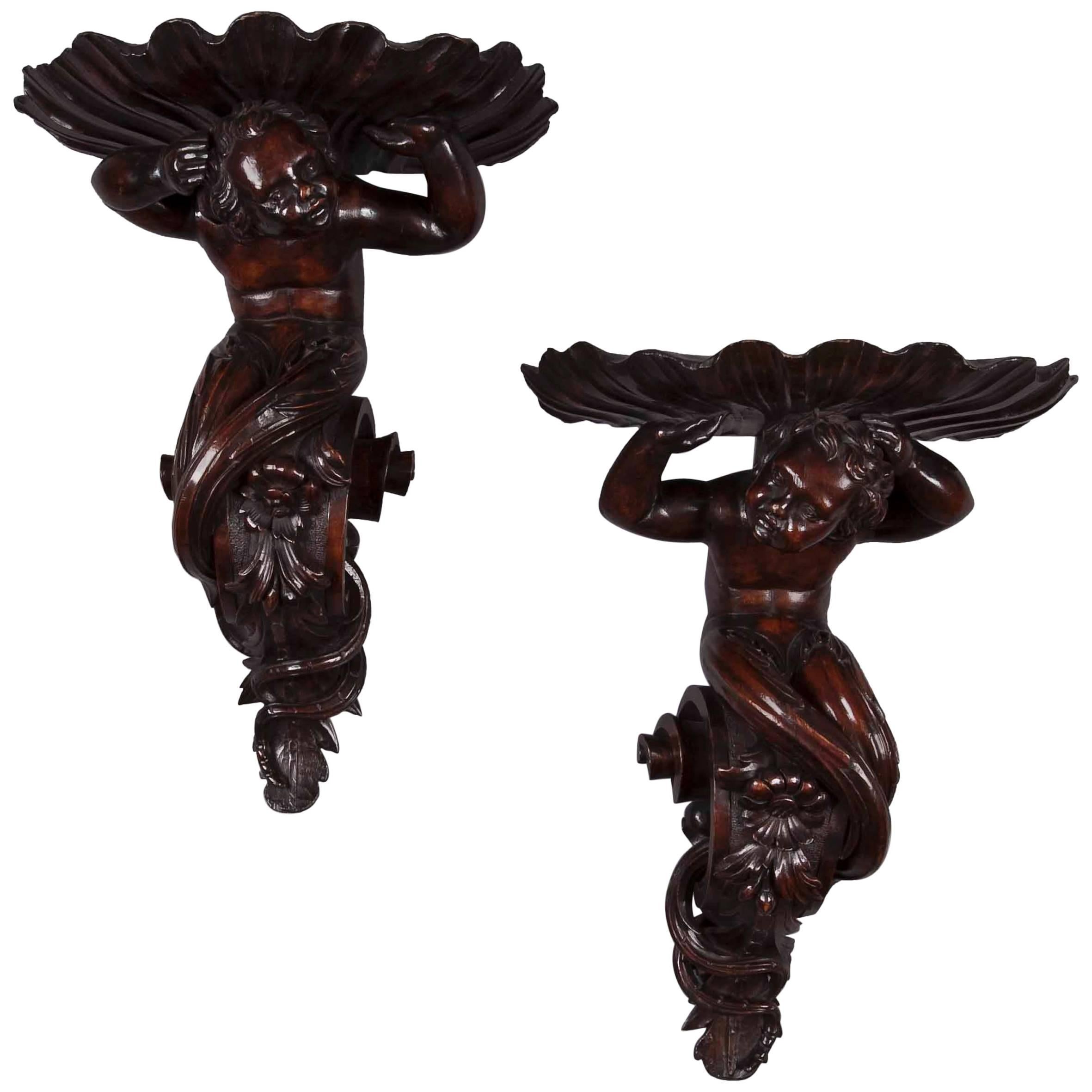 Pair of Italian Carved Walnut Wall Brackets with Mermen and Shells