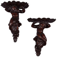 Antique Pair of Italian Carved Walnut Wall Brackets with Mermen and Shells