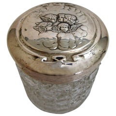 Edwardian Sterling Lidded Glass Vanity Jar of Cherub Design