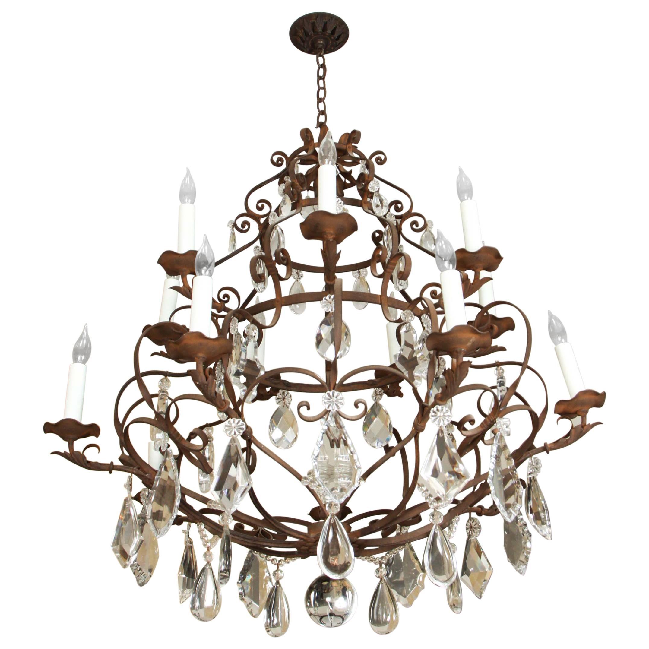 Grand Fourteen-Light Iron and Crystal Chandelier For Sale