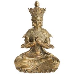 Intricately Etched Bronze Sculpture of a Seated Diety Figure