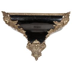 A Napoleon III ebonised French Louis XV style wall bracket with brass mounts 2