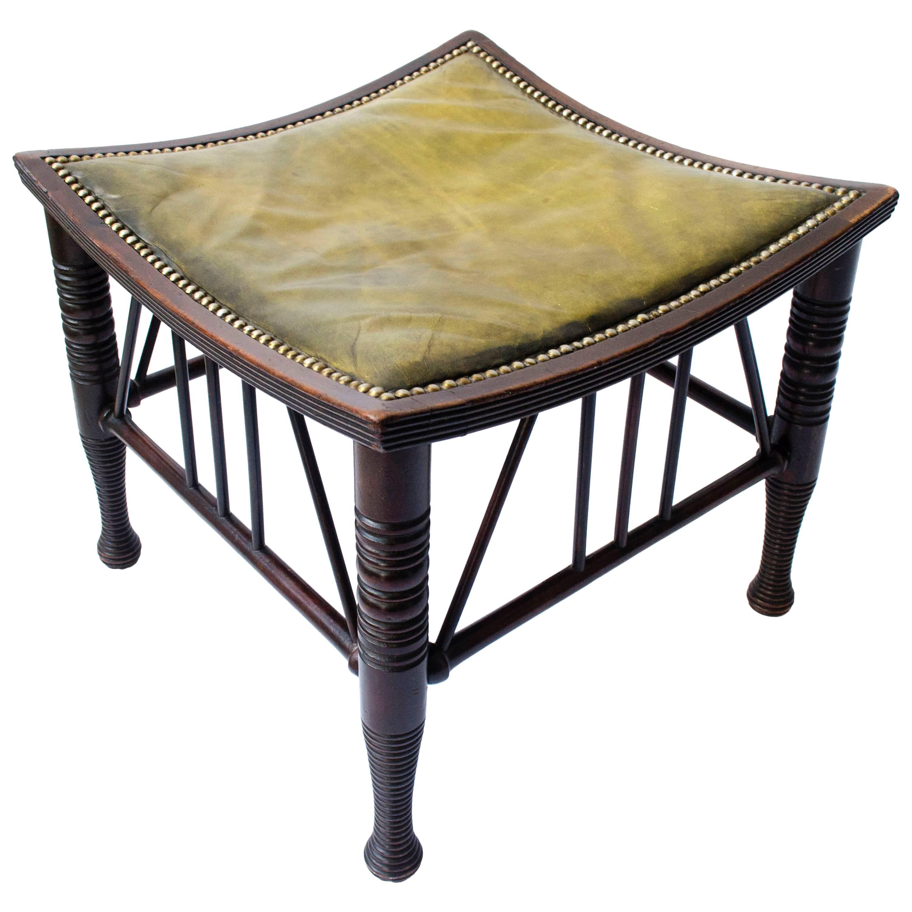 Liberty & Co A Large Size Walnut Thebes Stool with ring turned legs & stretchers For Sale