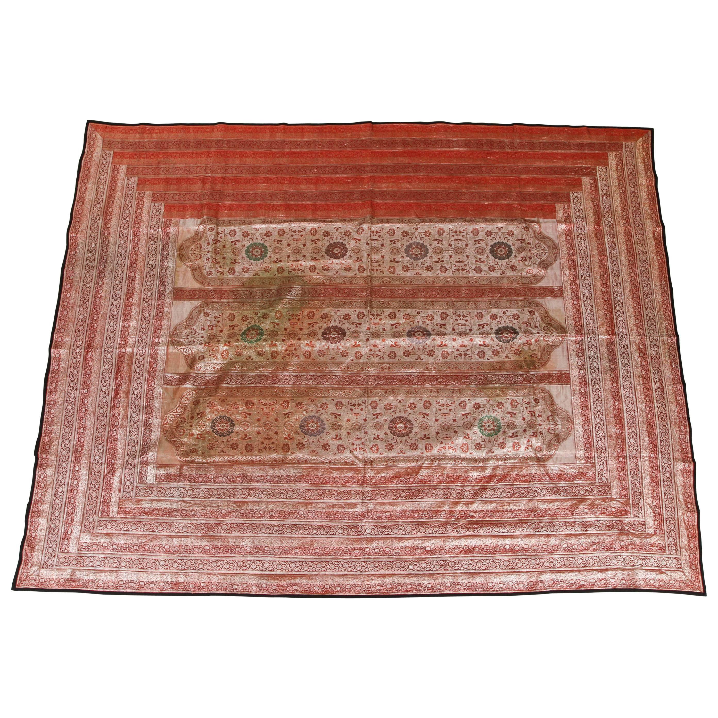 Indian silk sari tapestry quilt patchwork.
Nice red lame silk fabric with Moorish Moroccan style arches.
Lined with black fabric,
could be used a a bed cover or hanging on the wall.
All of our textiles are handmade and original designs, the making