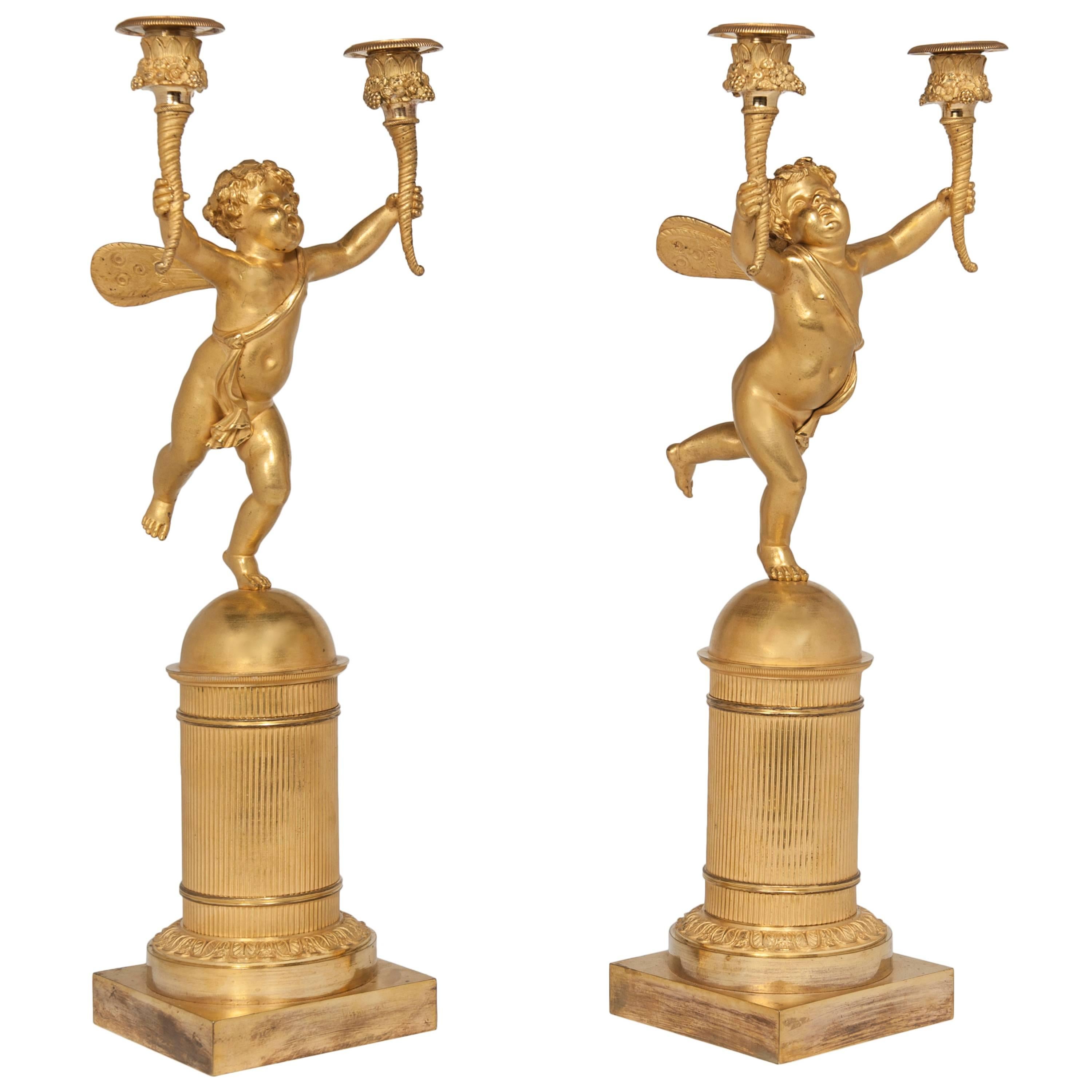 Pair of Two-Armed Empire Ormolu Candlestick with Cupids, circa 1820 For Sale