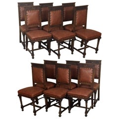 Set of Twelve Italian Neoclassical Hand-Carved Walnut Chairs with Leather