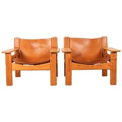 Pair of Leather and Wood Spanish Bernt Petersen Armchairs