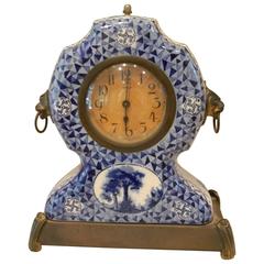 French Porcelain Clock on a Brass Base and Lion Head Handles, 20th Century