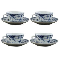 Four Sets of Royal Copenhagen Blue Fluted Half Lace, Tea Cup and Saucer