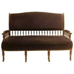 Antique Collinson & Lock. An Anglo-Japanese Mahogany Settee with carved & scrolled arms