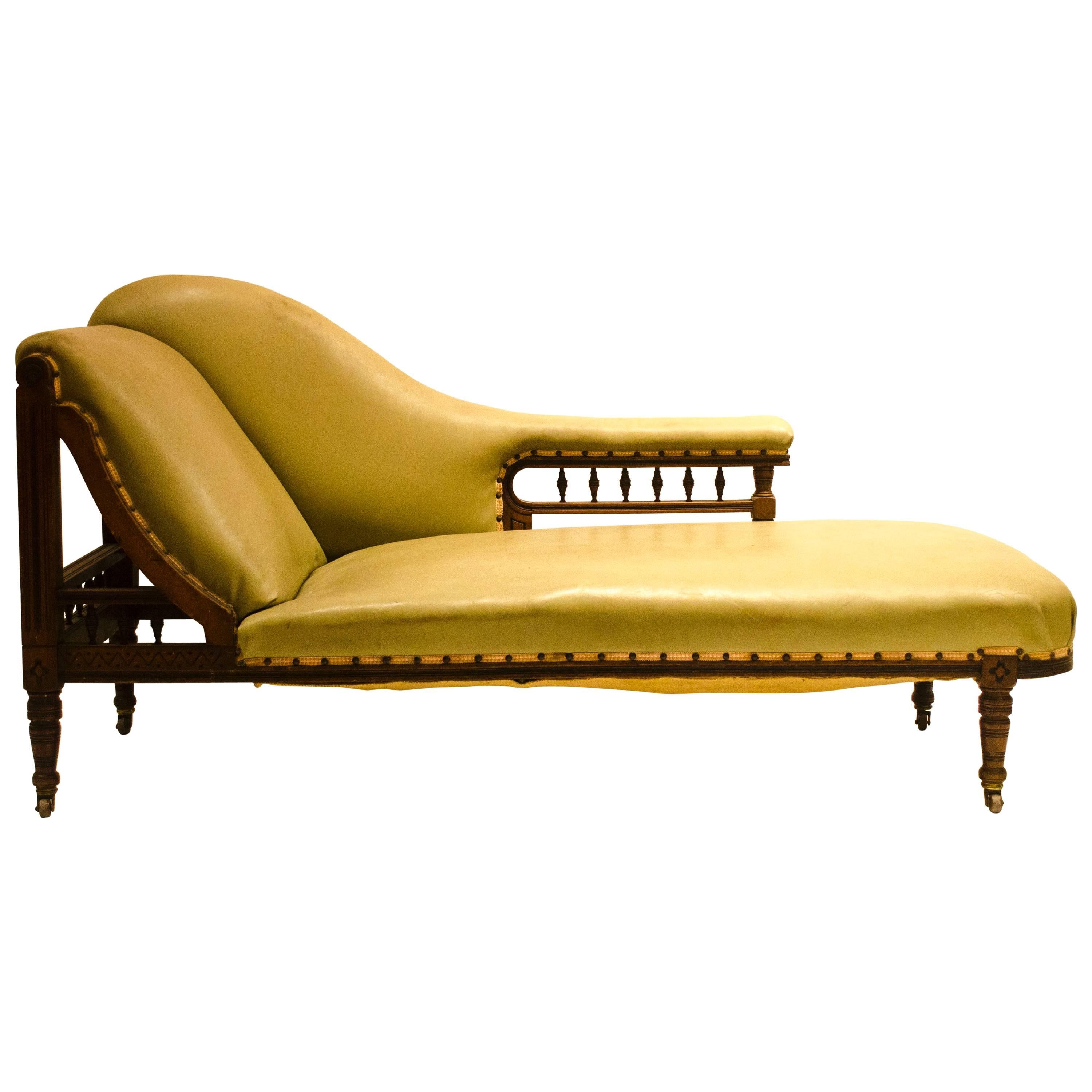 Thomas Collcutt attributed An Aesthetic Movement Walnut & Ebonized Chaise Lounge