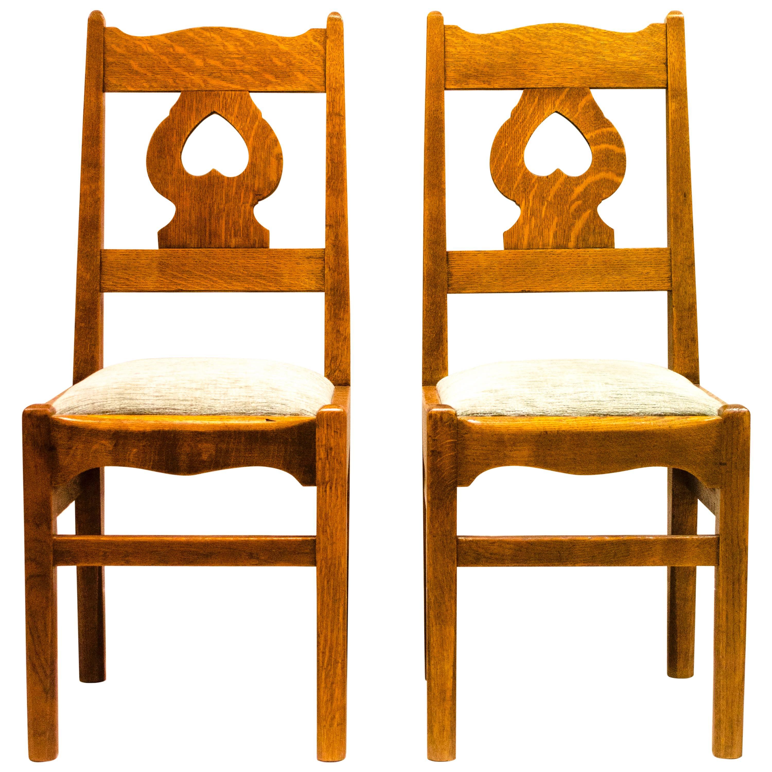 A Rare Pair of Arts & Crafts Oak Chairs by C F A Voysey