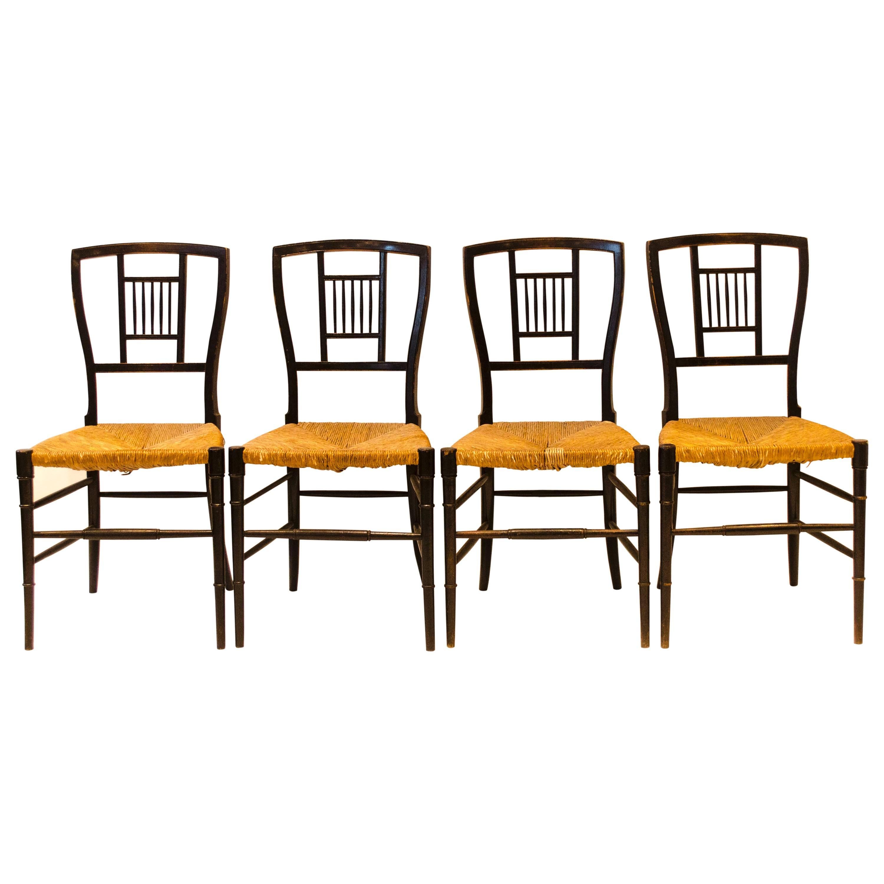 E W Godwin. A Set of Four Anglo-Japanese Ebonised Rush Seat Chairs