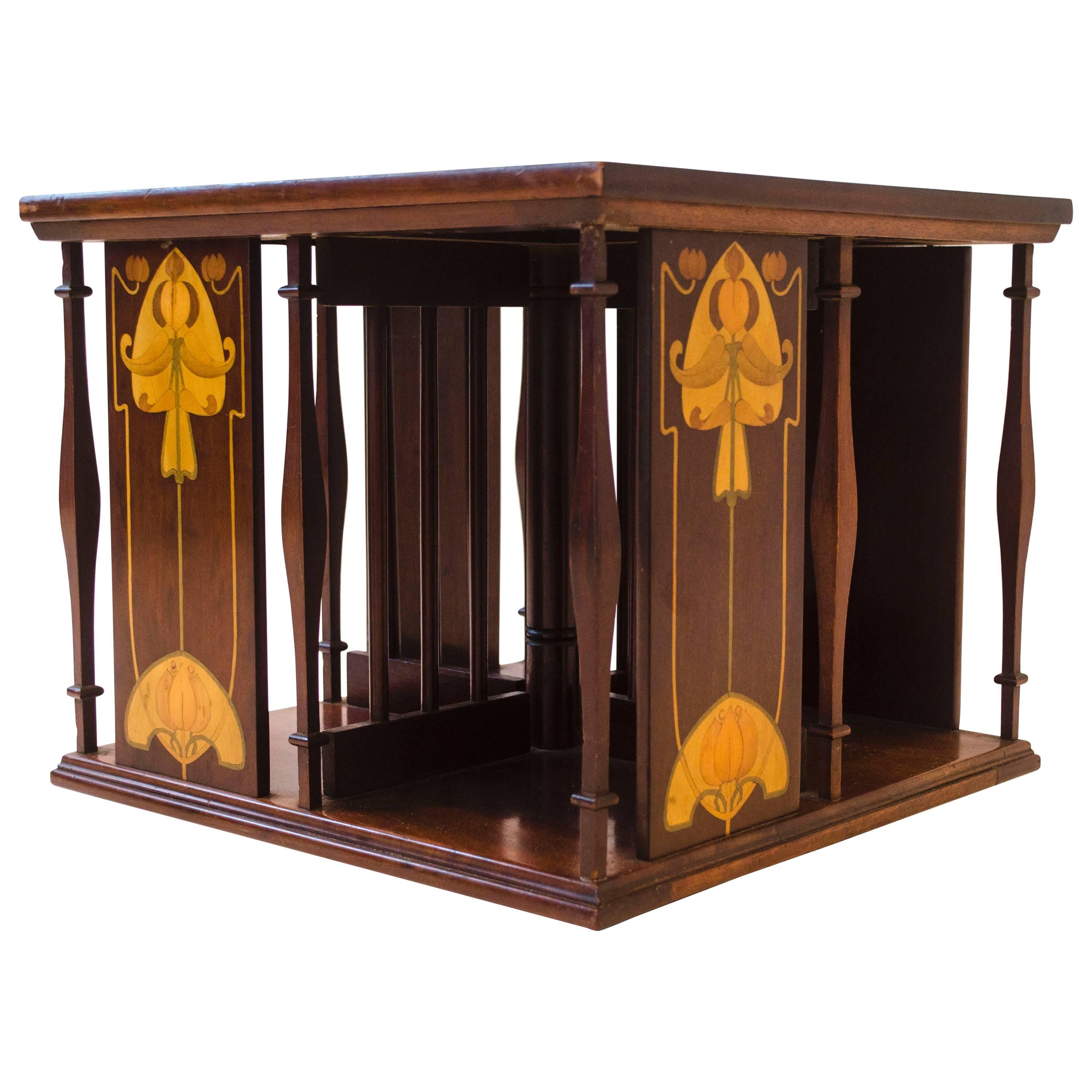 Shapland & Petter. An Arts & Crafts Table Top Revolving Inlaid Bookcase 