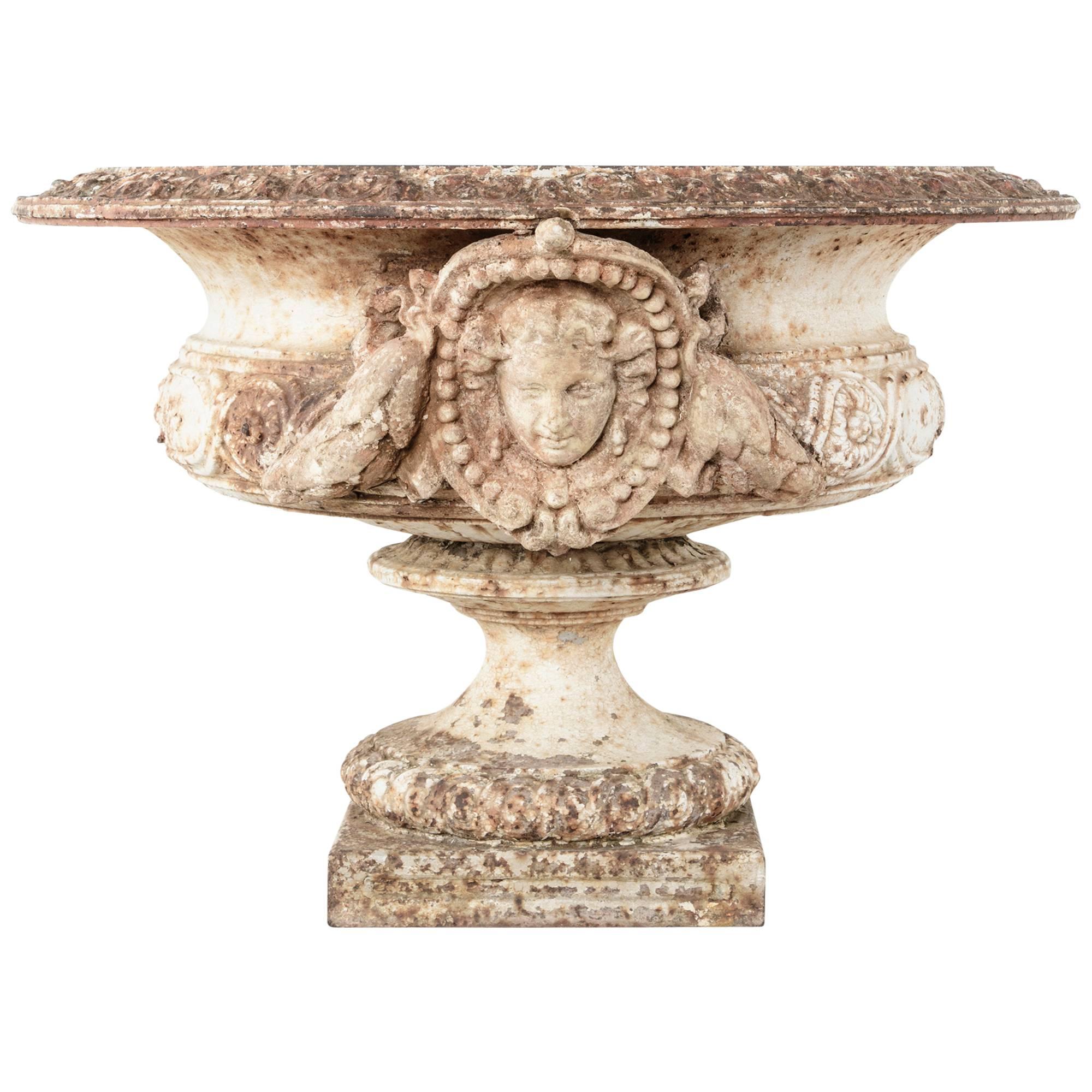 Grand Scale 18th Century French Cast Iron and Stone Urn with Neoclassical Faces