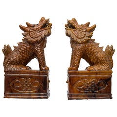 Pair of Chinese Umber Glazed Porcelain Foo Lions