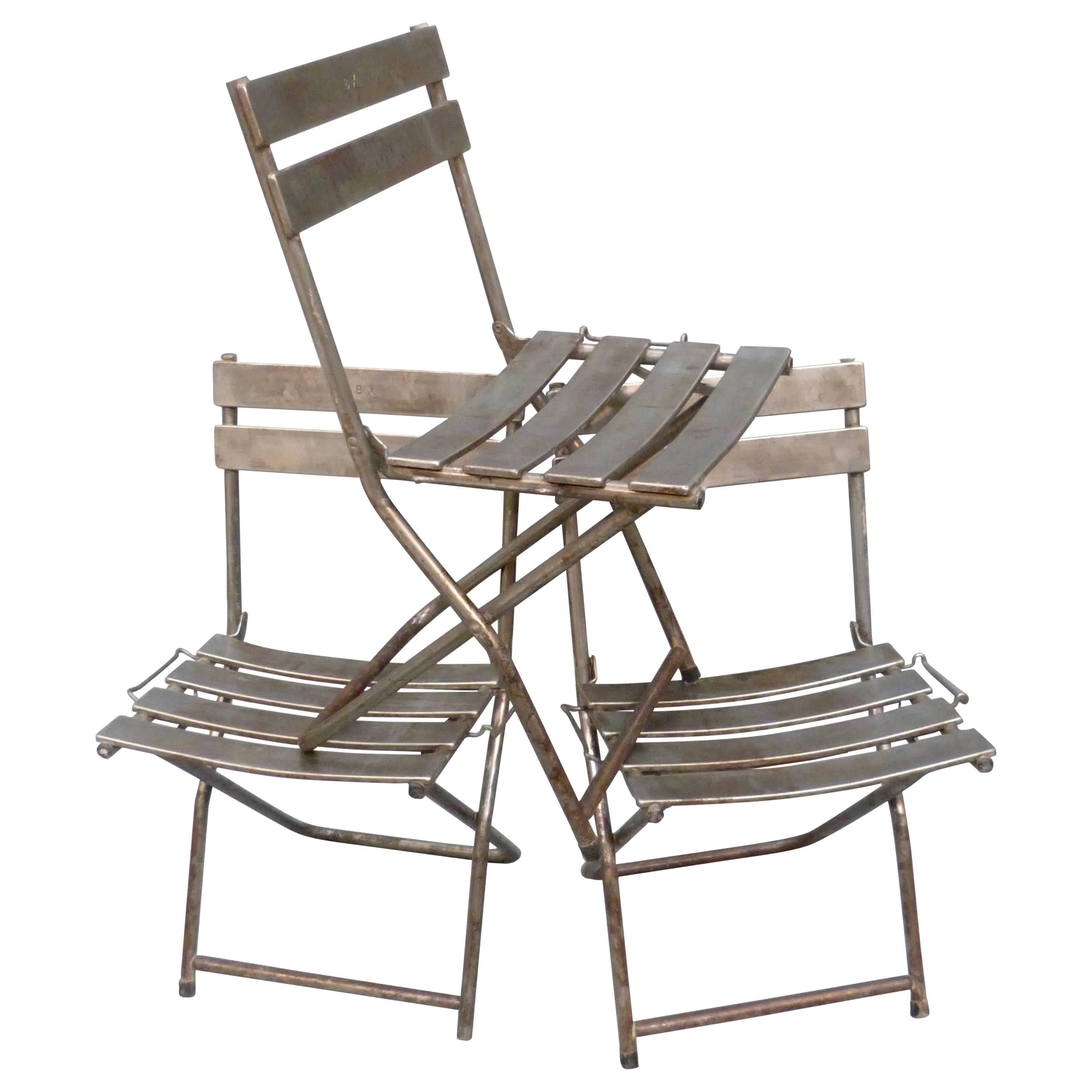 Set of Eight French Folding Steel Chairs For Sale