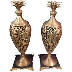 Pair of Brass Ornamental Sculptures on Steel Bases with Brass Feet