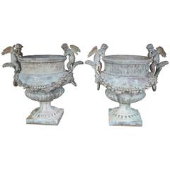 Pair of Verde Patinated Large Bronze Planters with Winged Cherubs and Garland