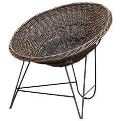 Jacques Adnet Style Natural Woven Rattan Basket Chair With Black Wire Base