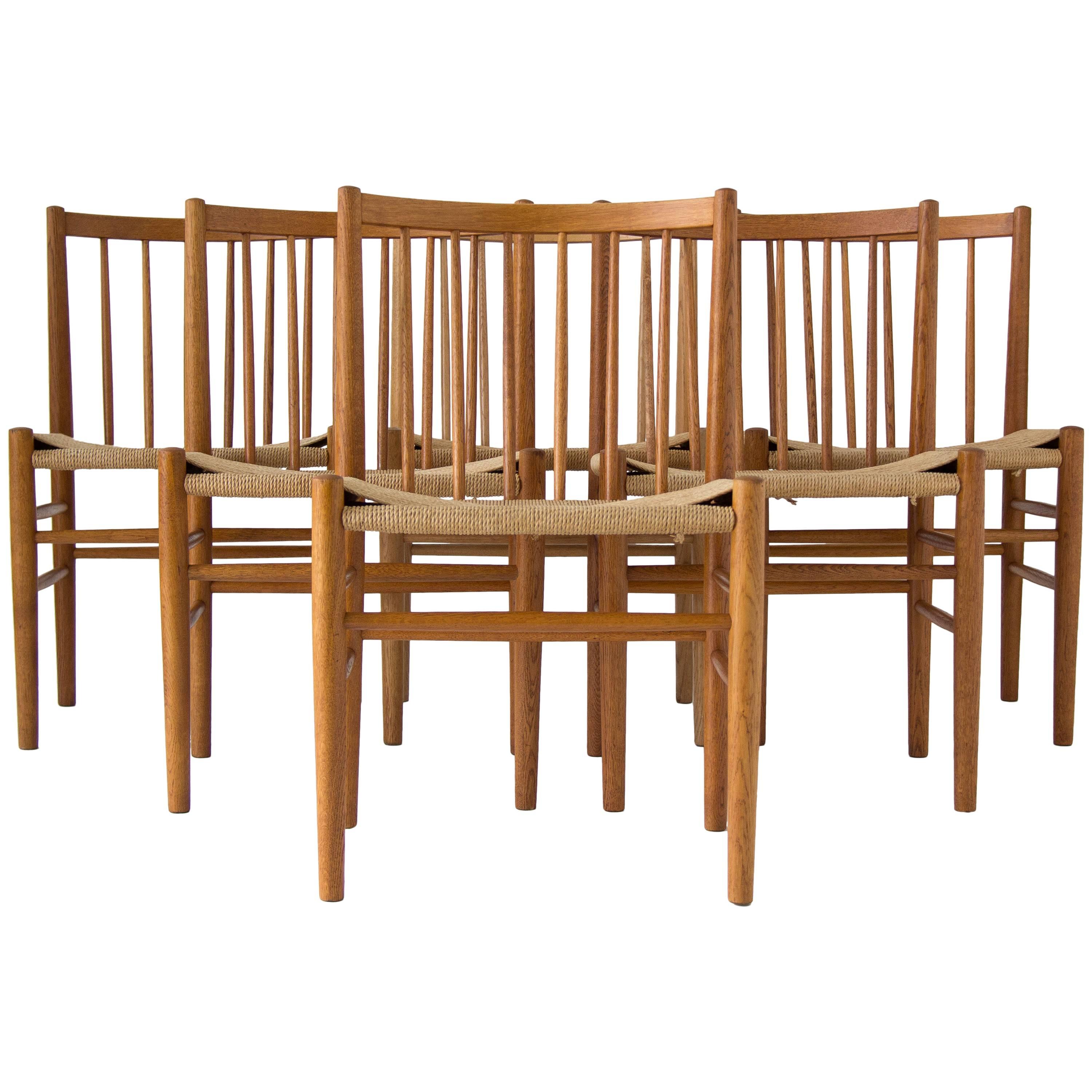 Six Spindle-Backed Oak and Danish Cord Dining Chairs