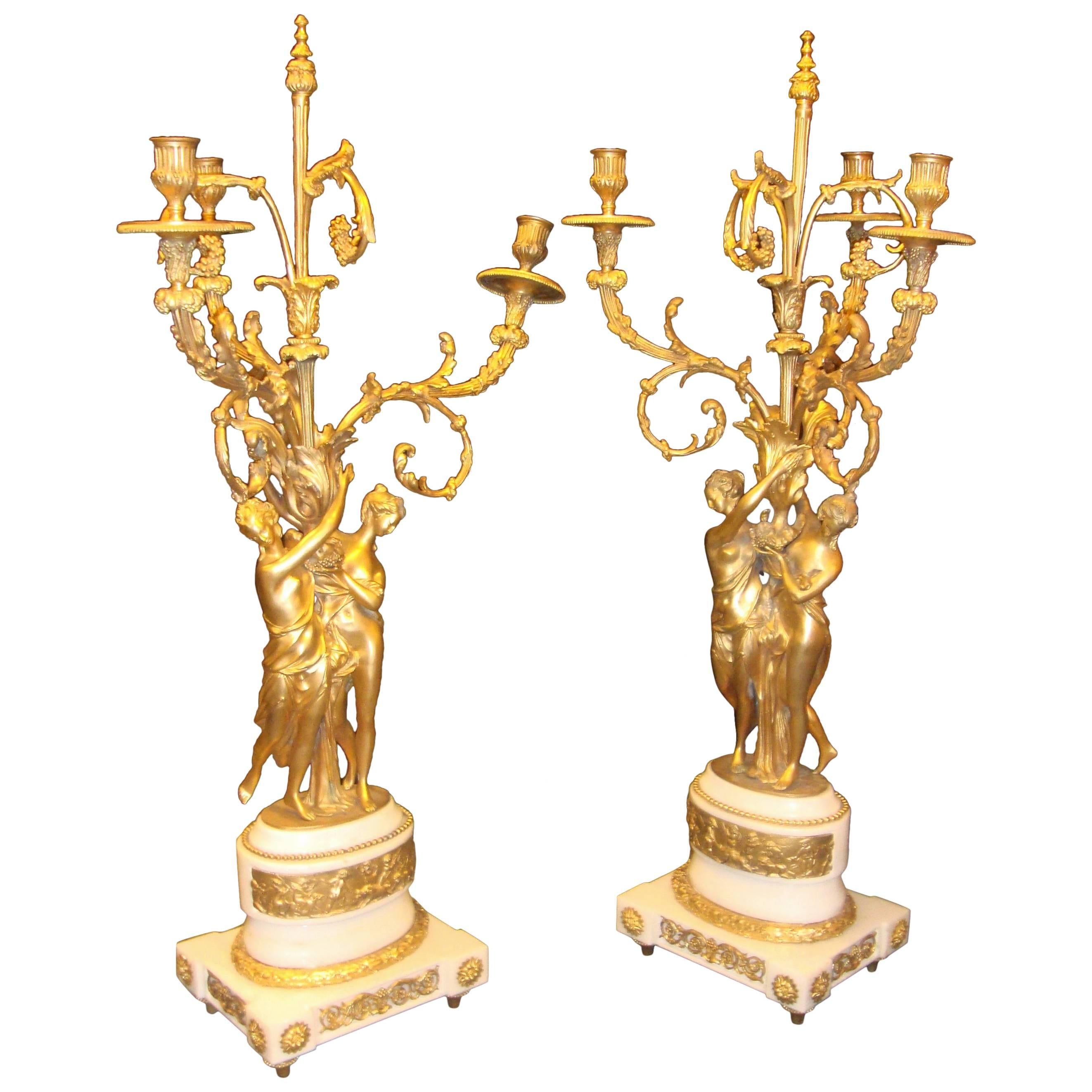 Pair of Figural Bronze Candelabras on Marble Bases