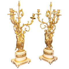 Pair of Figural Bronze Candelabras on Marble Bases
