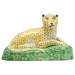 Antique Creamware Bodied Figure of a Reclining Leopard, Staffordshire, England