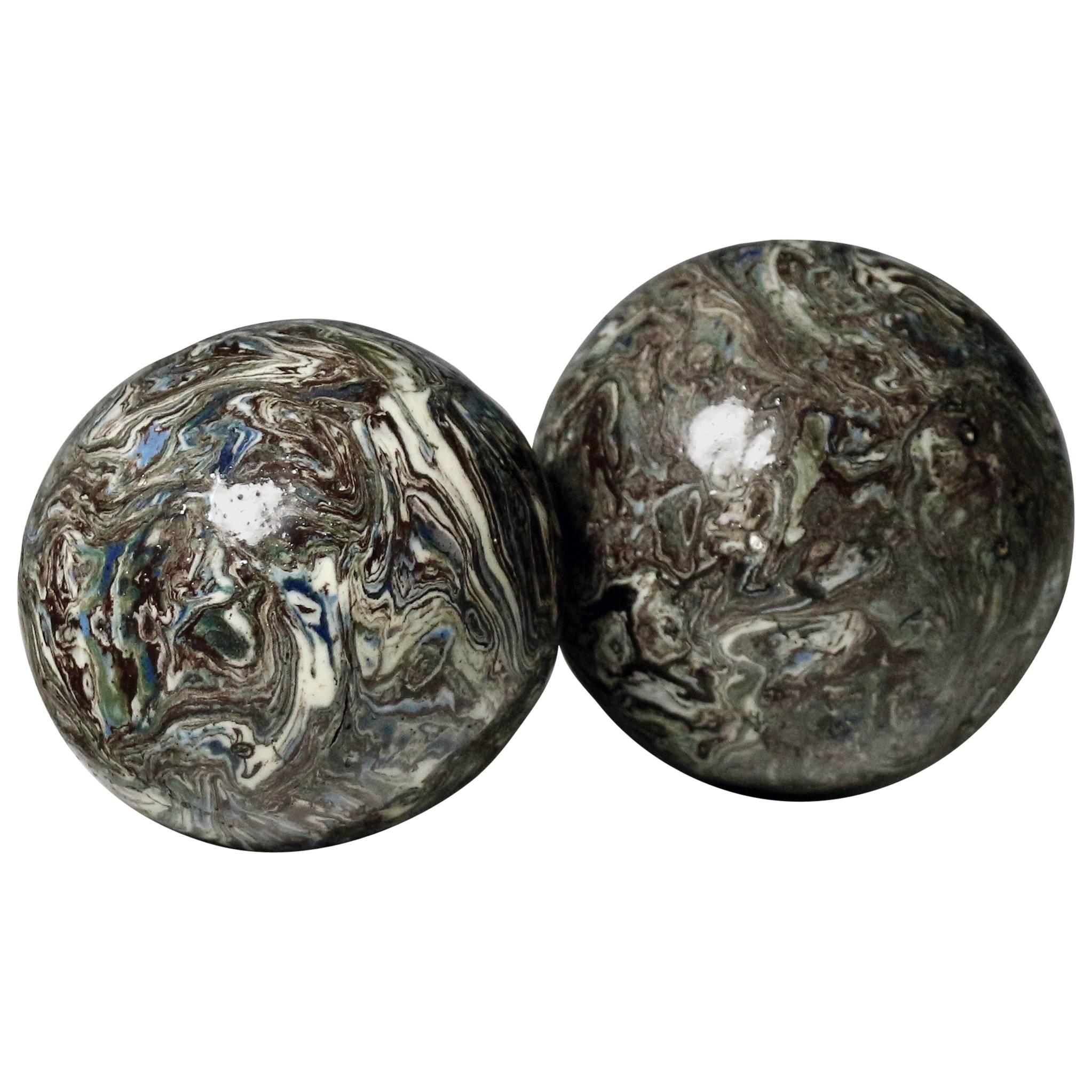 Two Variegated Agateware Pottery Balls 18th century. For Sale