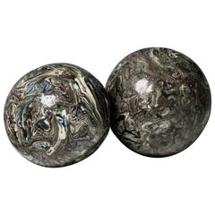 Two Variegated Agateware Pottery Balls 18th century.
