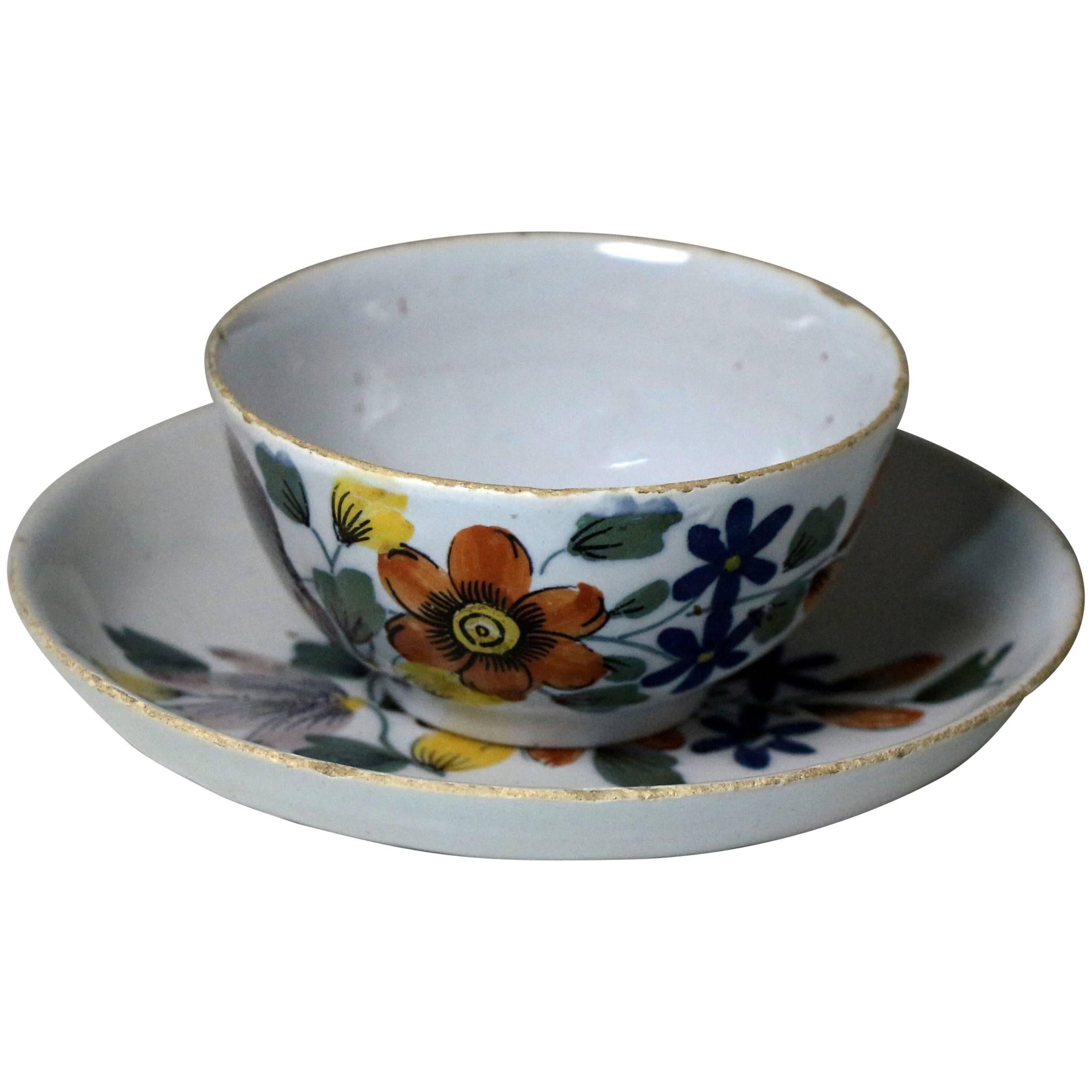 Delftware Pottery Polychrome Decorated Tea Bowl and Saucer, Liverpool Delftworks