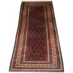 Antique Baluch Rug with Lotus Leaf Lattice Design and a Camel Border, circa 1900