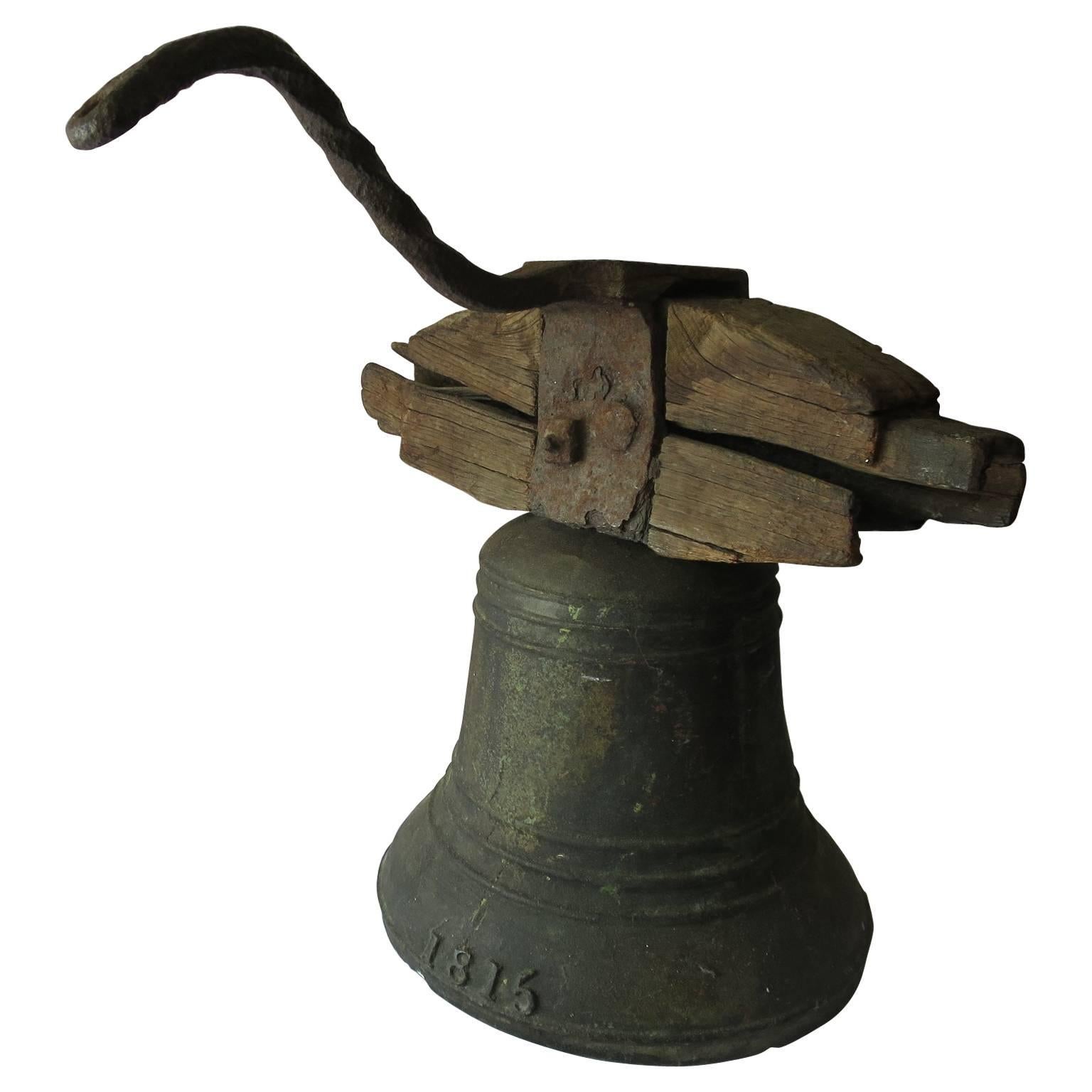 Property Bronze Airin Bell Dated 1815 with its Wrought Iron Top and Wood Beam For Sale
