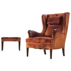 Frits Henningsen Wingback Chair and Ottoman in Original Cognac Leather