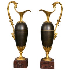 Pair of Period Empire Patinated and Gilt Bronze Ewers