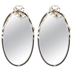 Pair of Painted and Parcel Silver Gilt Oval Mirrors