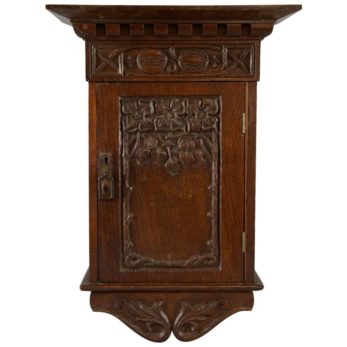 Arts and Crafts Carved Oak Wall Cabinet