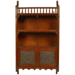 Antique  E W Godwin Attr An Anglo-Japanese Oak Wall Cabinet with embossed Leather Panels