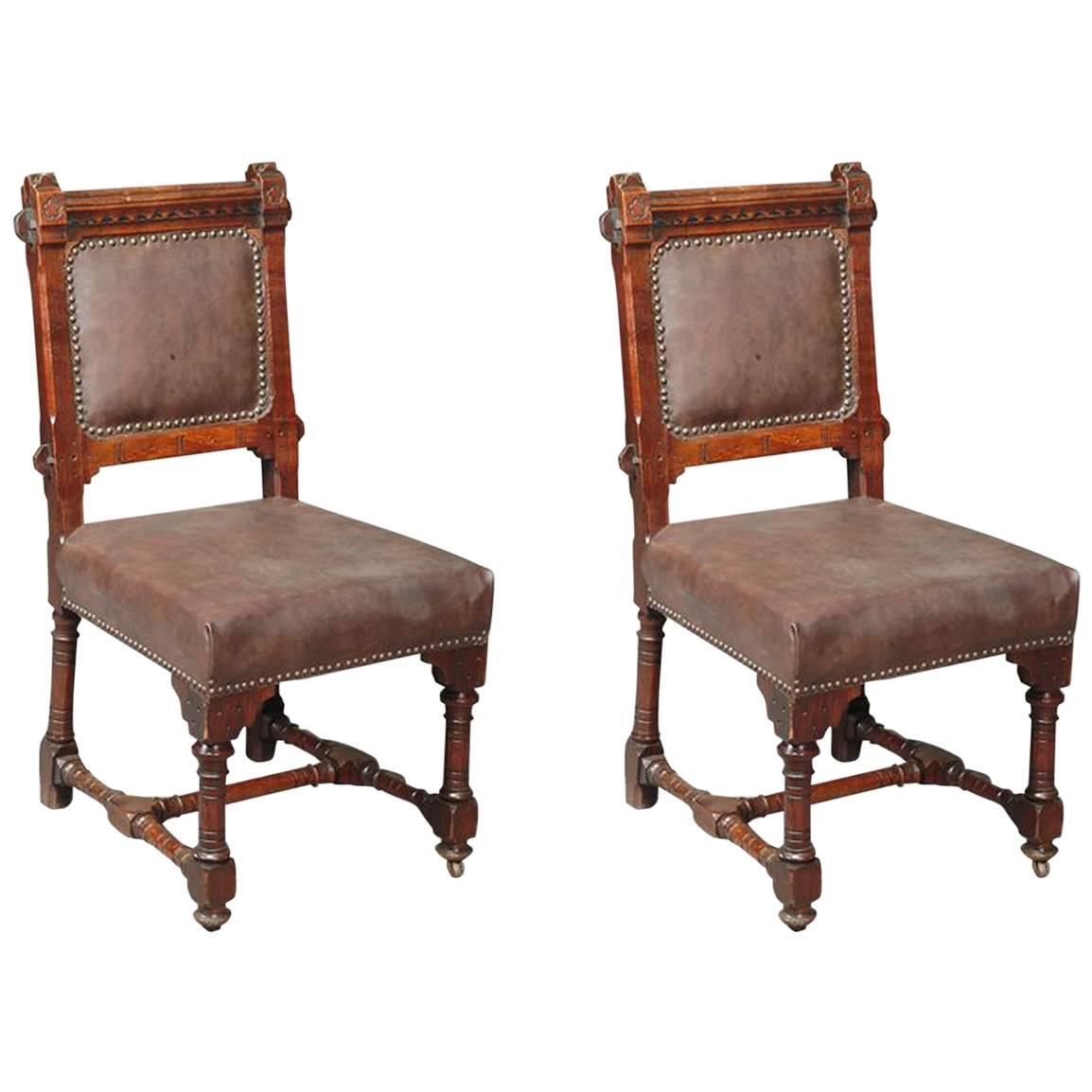 John Pollard Seddon A pair of Gothic Revival oak dining chairs. 4 more available