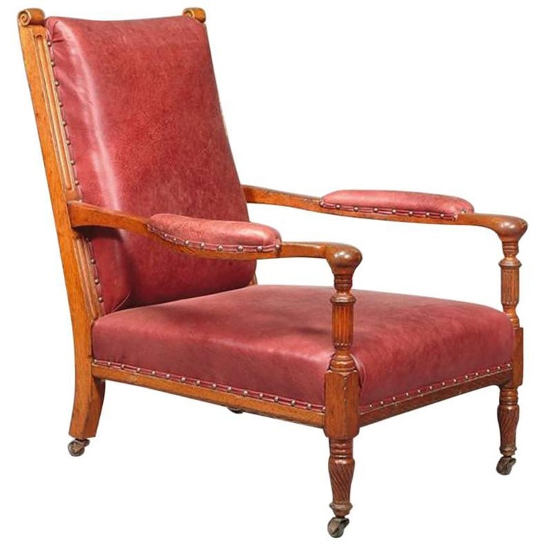 Henry William Batley attri,  Jas. Shoolbred. An Aesthetic Movement Oak Armchair. For Sale