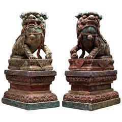 Antique Chinese Pair of Polychromed Stone Fu Dogs from the Ming Dynasty