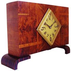 French Art Deco Poly-Chrome Veneer, Macassar and Brass Geometric Mantel Clock