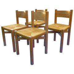 Set of Four Charlotte Perriand Oak Chairs for Méribel, circa 1950