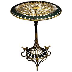 Intricate Art Deco round ironwork table with birds and leaf motif, 20th century