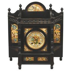 Aesthetic Movement Ebonised and Gilt Painted Panel Mantel Clock